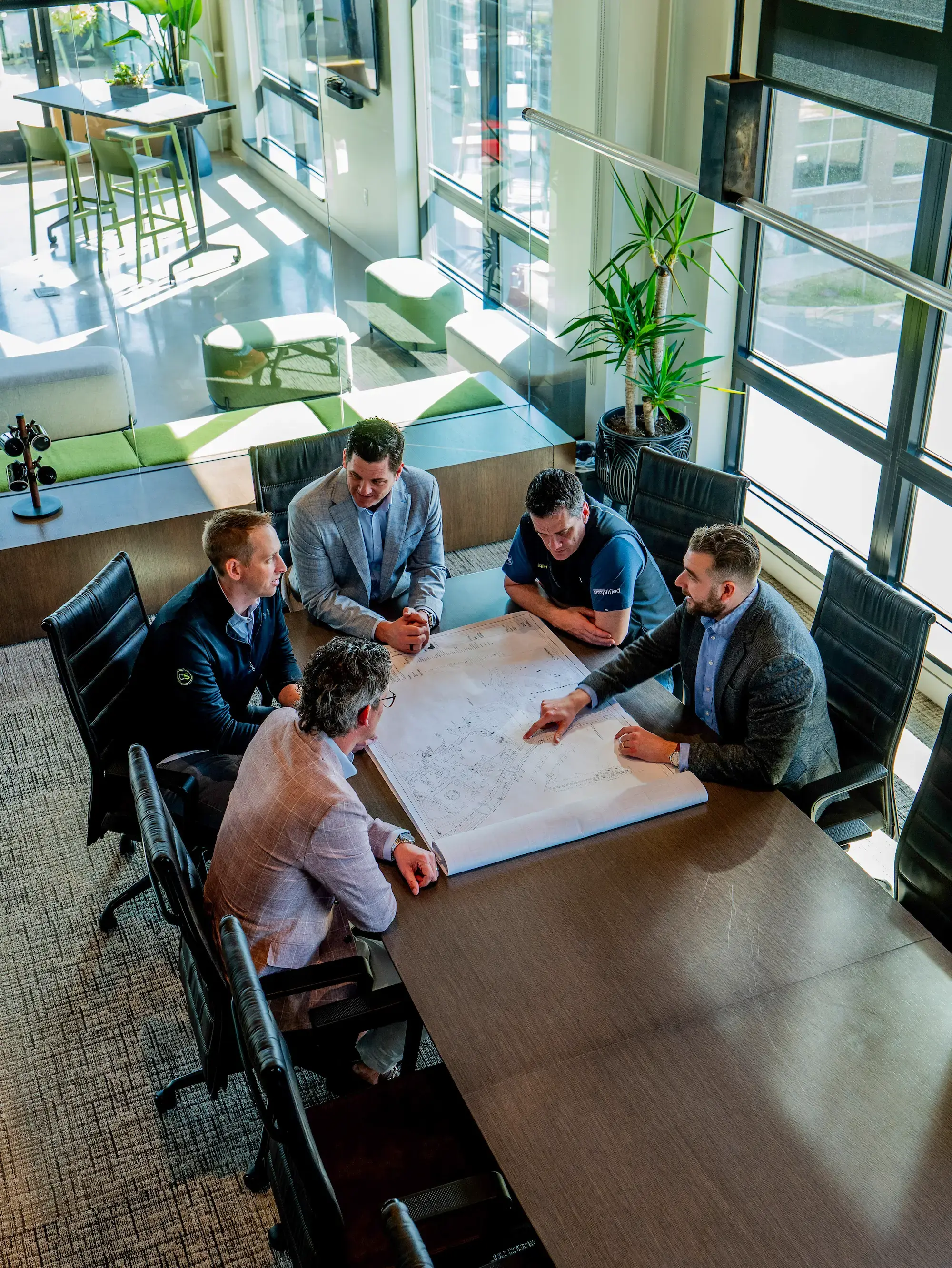 Owner's representative with project team on construction site